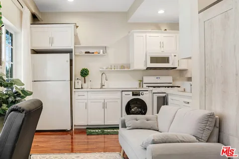 a utility room with sink washer and dryer