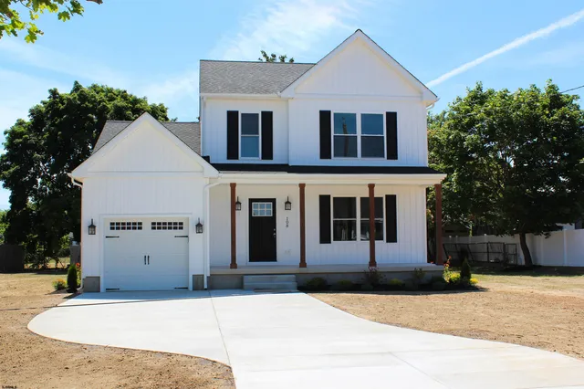 a front view of a house with garage