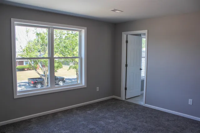 an empty room with a gallery