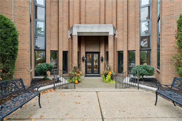 a view of a house with potted plants
