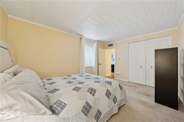 a bathroom with a granite countertop sink a toilet and shower