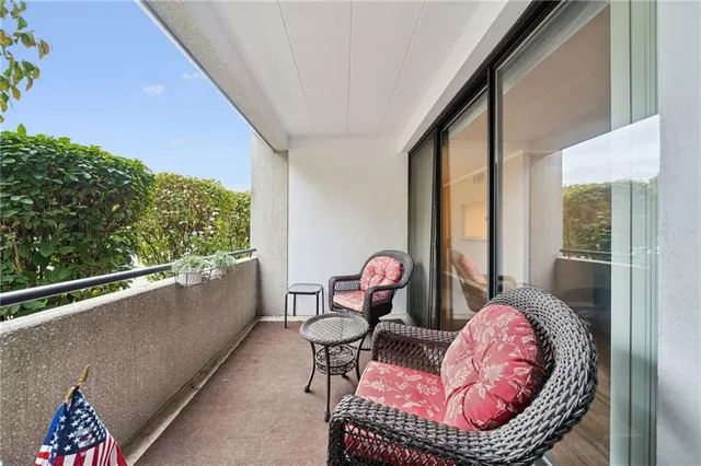 a view of parking garage with cars