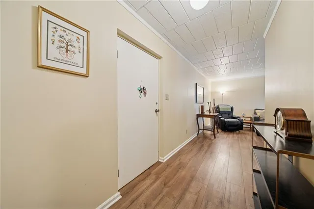 a view of a livingroom with furniture and a flat screen tv