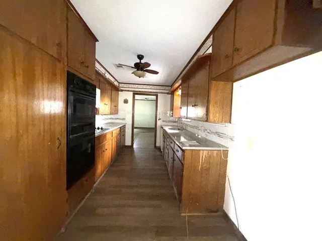 a kitchen with stainless steel appliances a refrigerator and a stove