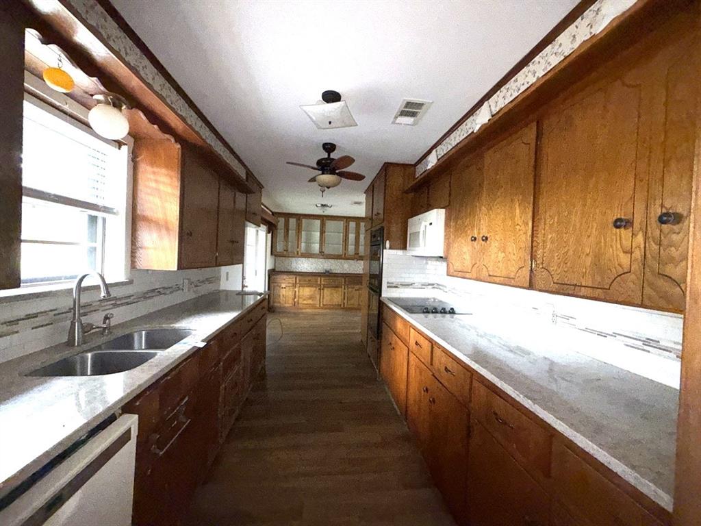 150 Lazy Way Fairfield, TX 75840 - Photo 3 of 21 a large kitchen with stainless steel appliances granite countertop a lot of counter space and a sink