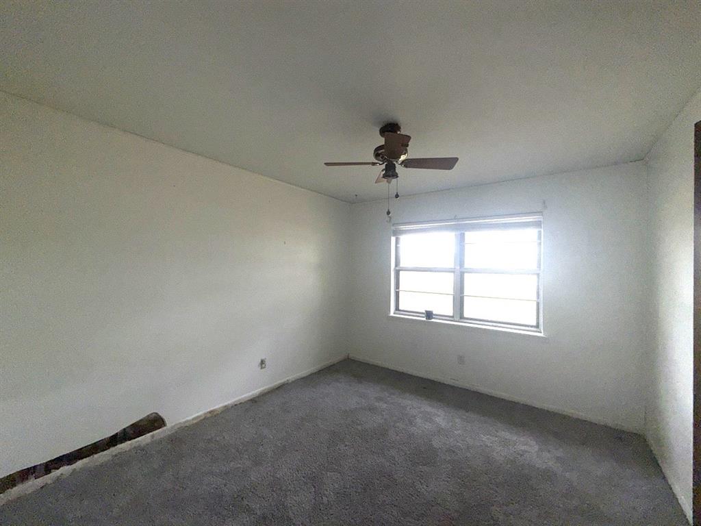 150 Lazy Way Fairfield, TX 75840 - Photo 8 of 21 an empty room with a window and a fan