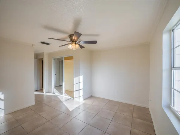 a view of an empty room with a window