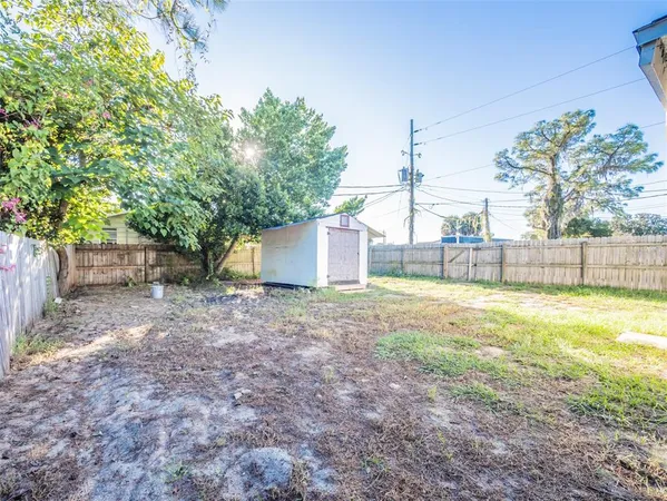 a view of a backyard with swimming pool