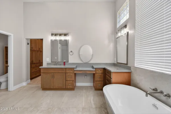 a view of a livingroom with furniture and a floor to ceiling window