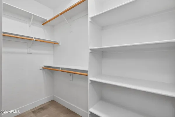 a view of a livingroom with a ceiling fan and window