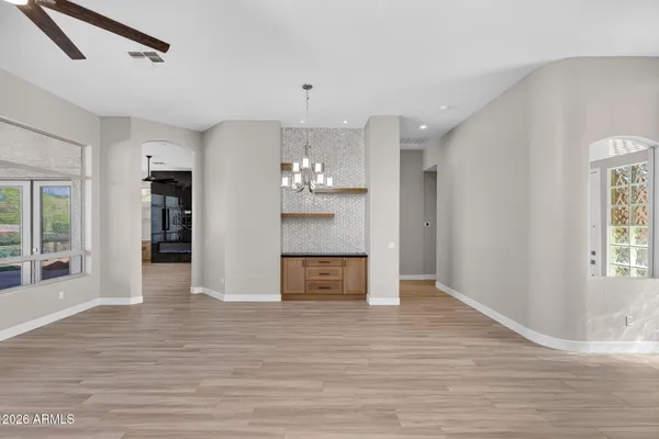 a view of a house with swimming pool and a yard