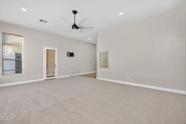 a view of a backyard with plants and lake view