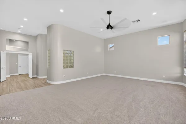 a view of a patio with couches table and chairs with potted plants