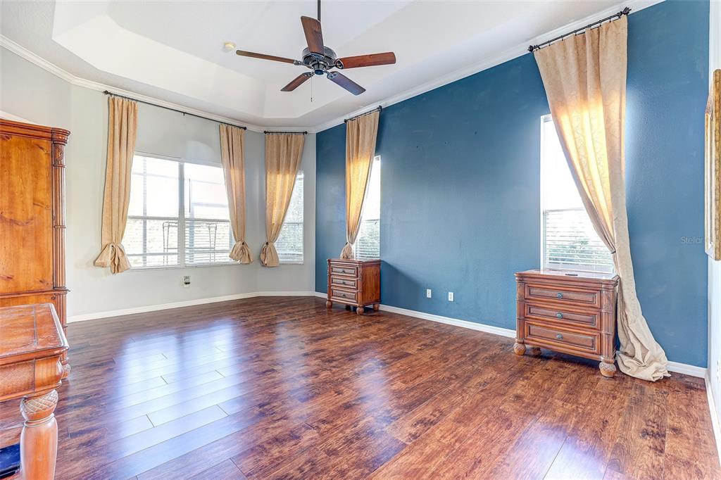 918 Algare Loop Windermere, FL 34786 - Photo 32 of 73 an empty room with wooden floor and windows