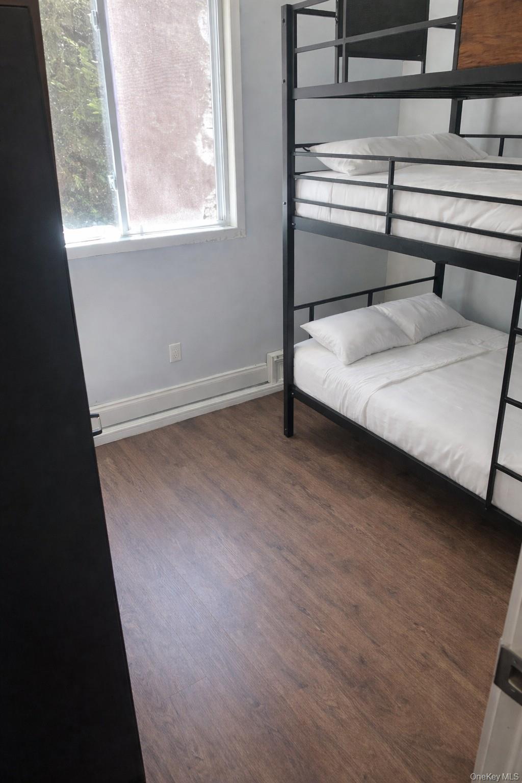 4 Halliday Road Coram, NY 11727 - Photo 13 of 19 a bedroom with a bed and a window