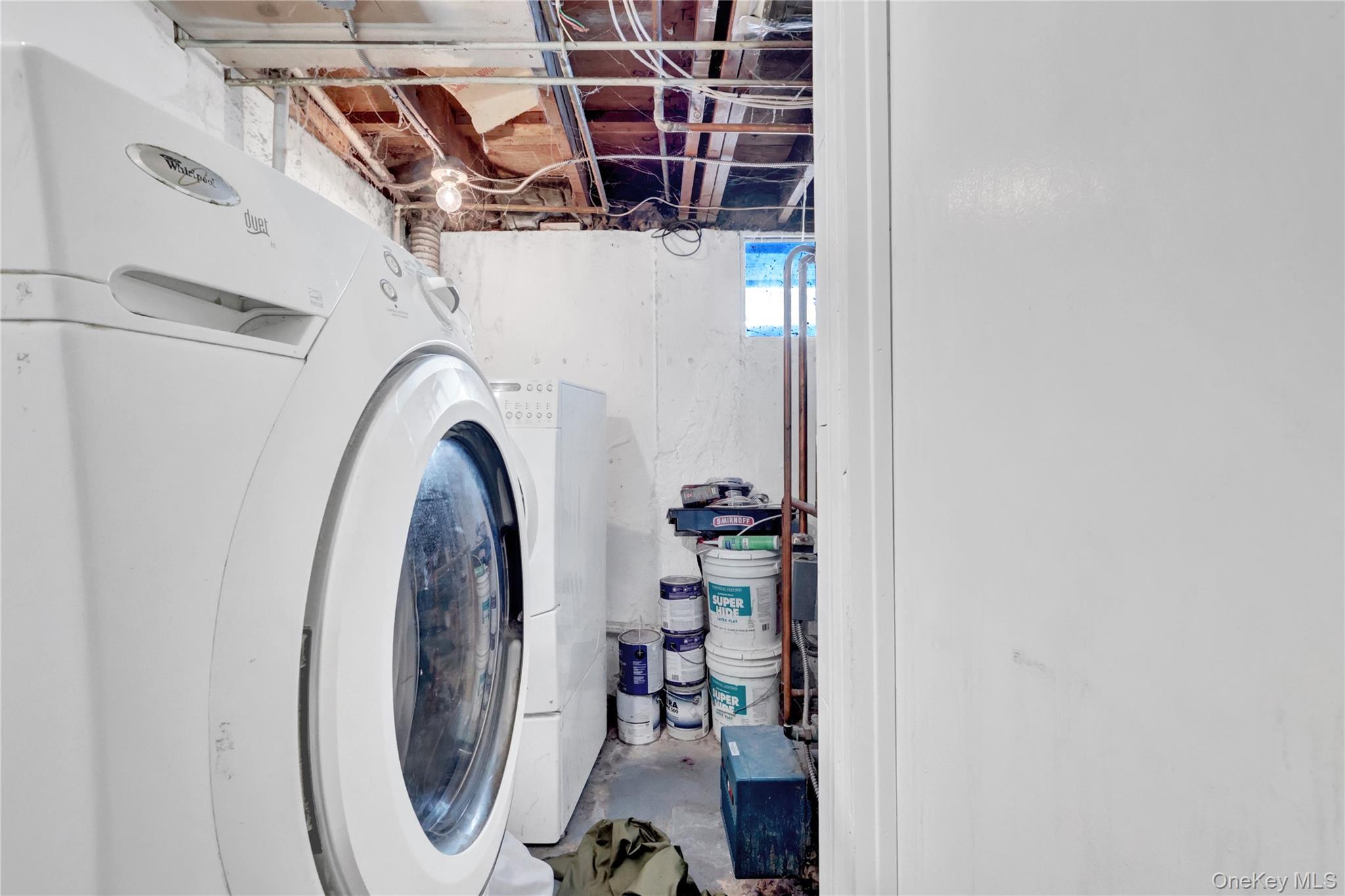 4 Halliday Road Coram, NY 11727 - Photo 17 of 28 view of livingroom with washer and dryer