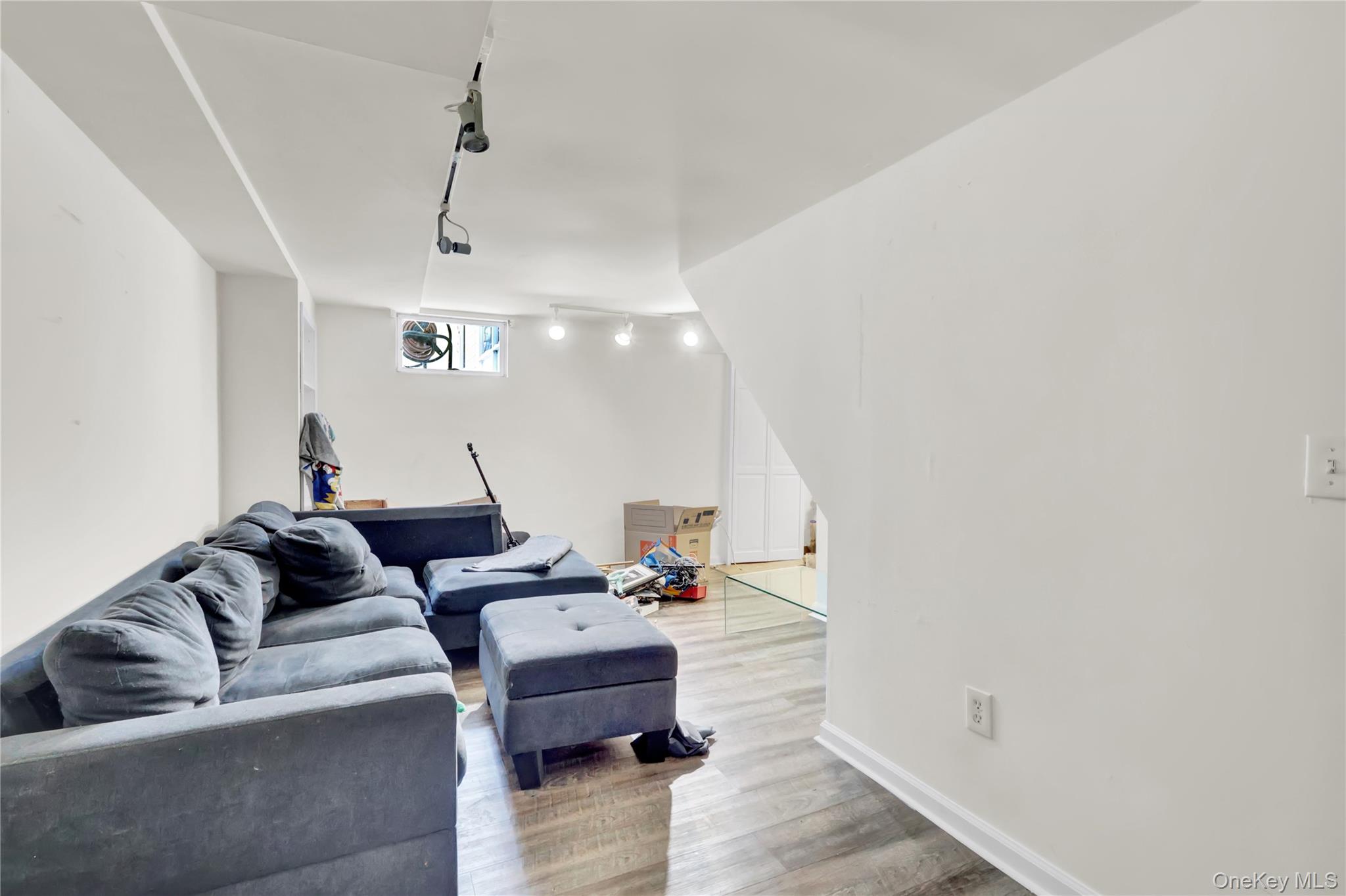4 Halliday Road Coram, NY 11727 - Photo 18 of 28 a living room with furniture and a ceiling fan
