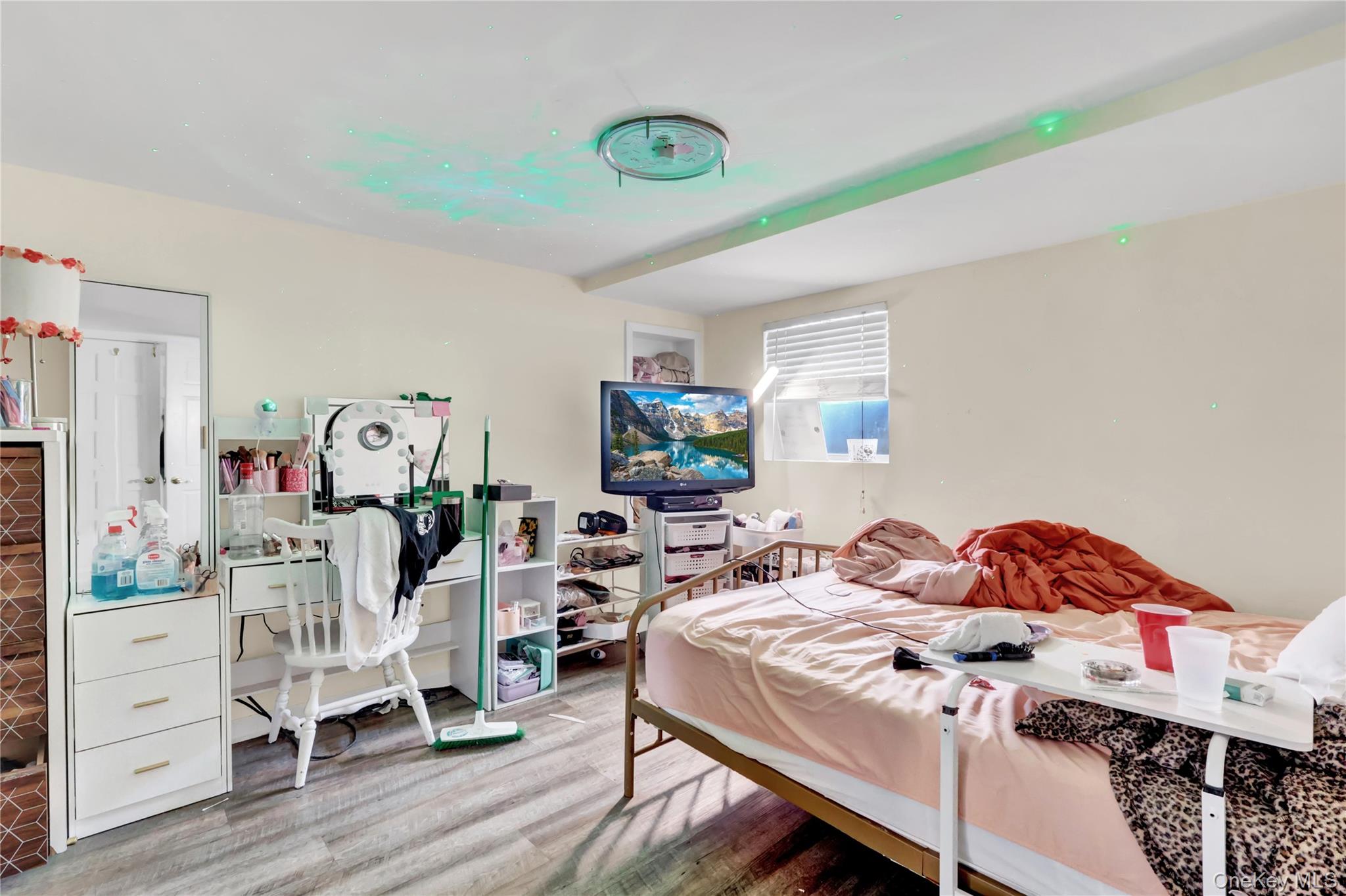 4 Halliday Road Coram, NY 11727 - Photo 20 of 28 a bedroom with a bed and wooden floor