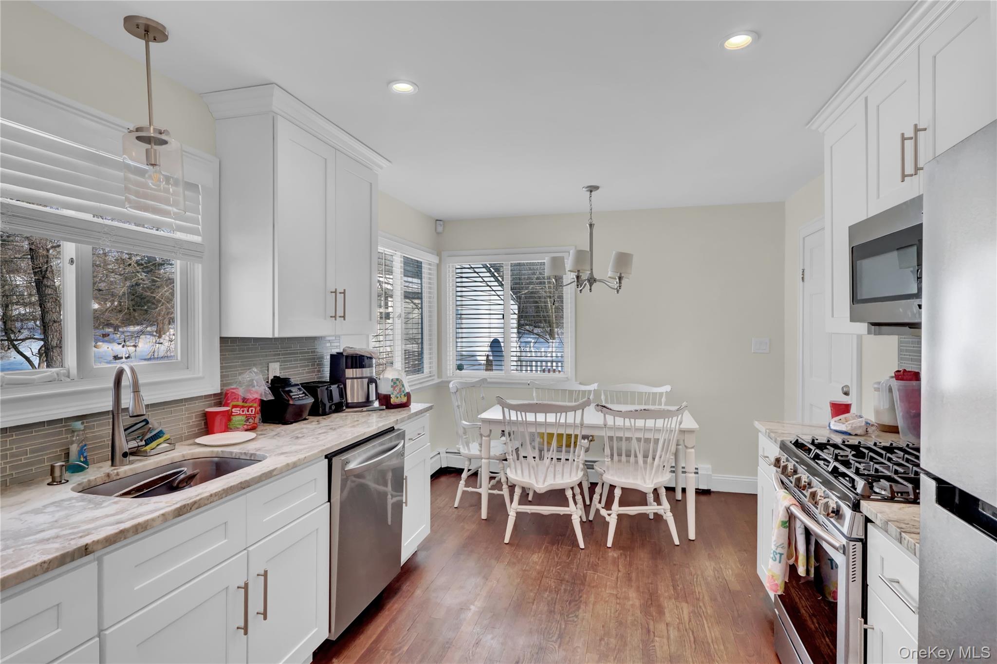 4 Halliday Road Coram, NY 11727 - Photo 6 of 28 a kitchen with a table chairs stove and cabinets