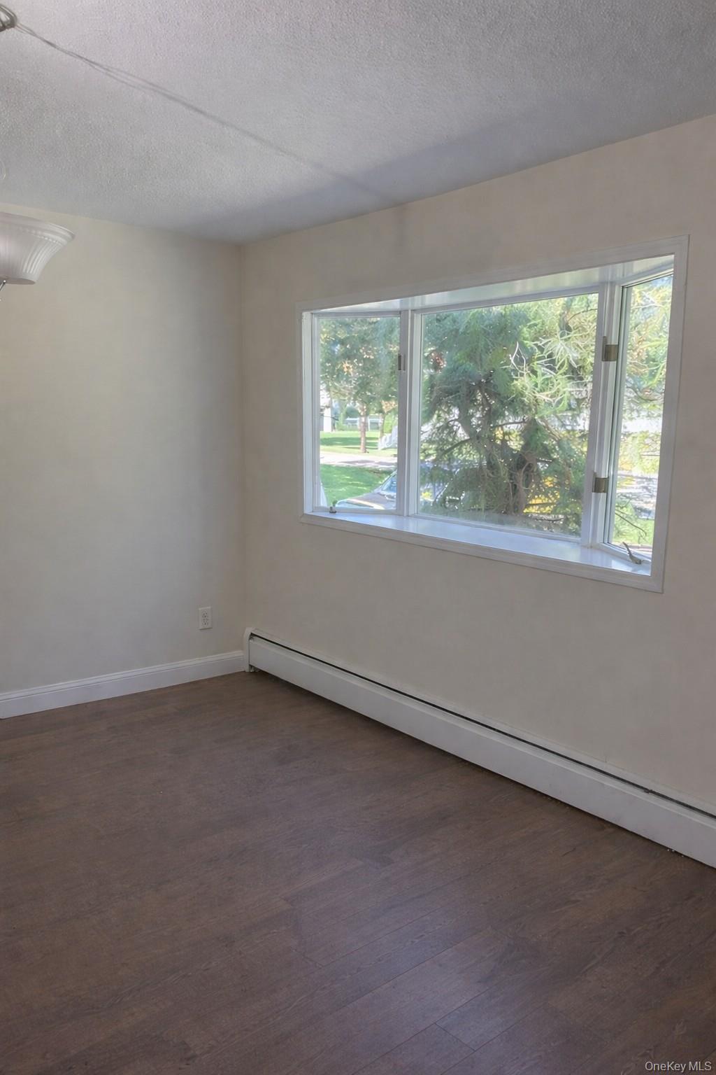 4 Halliday Road Coram, NY 11727 - Photo 8 of 19 an empty room with a window