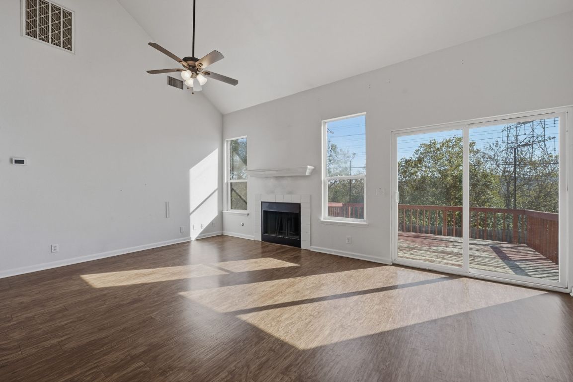 5237 Coppermead Lane Austin, TX 78754 - Photo 14 of 25 a view of a livingroom with a fireplace and window