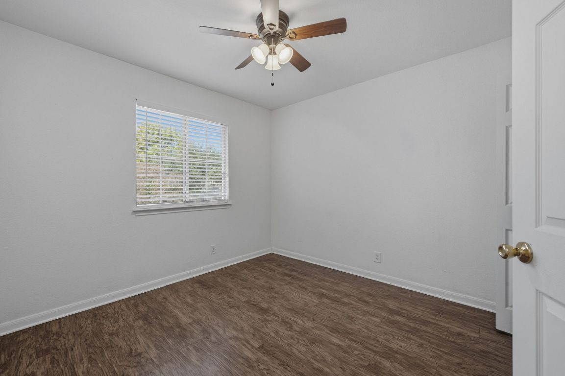5237 Coppermead Lane Austin, TX 78754 - Photo 19 of 25 an empty room with a window and a fan
