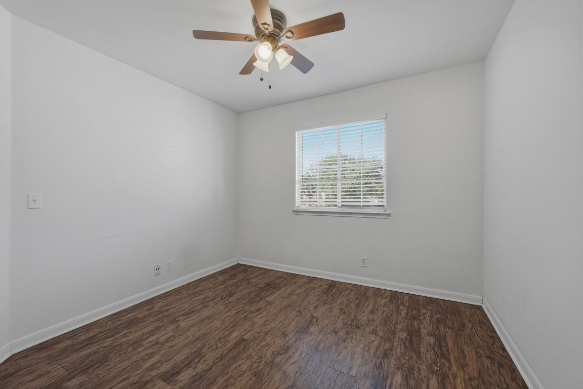 5237 Coppermead Lane Austin, TX 78754 - Photo 20 of 25 an empty room with a window and a fan