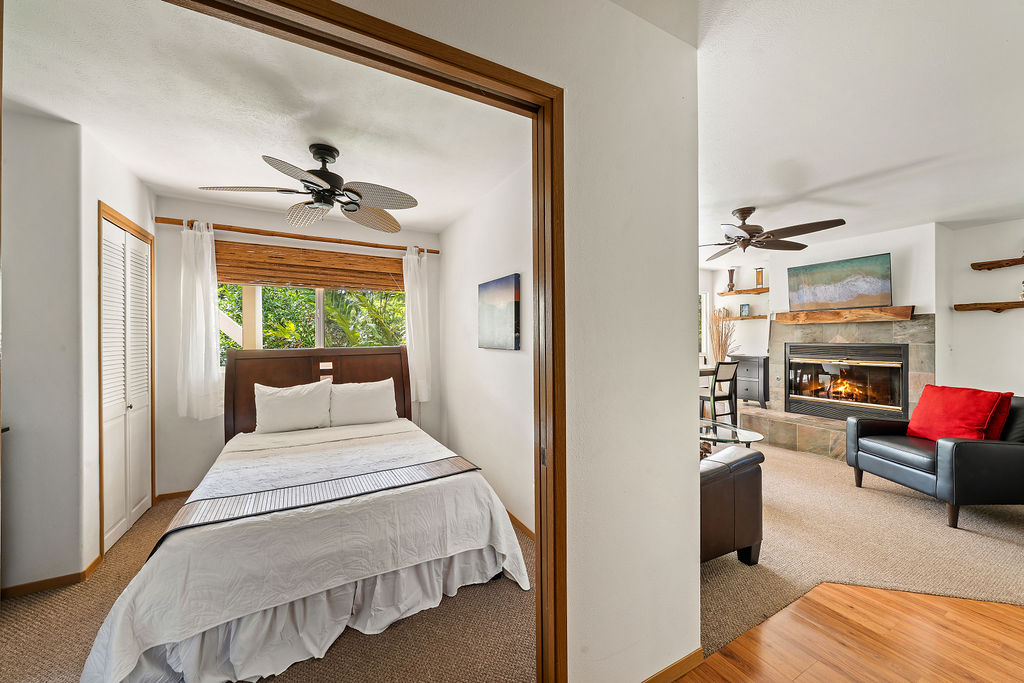 1444 East Kuiaha Road Haiku, HI 96708 - Photo 16 of 29 a bedroom with furniture and a large window