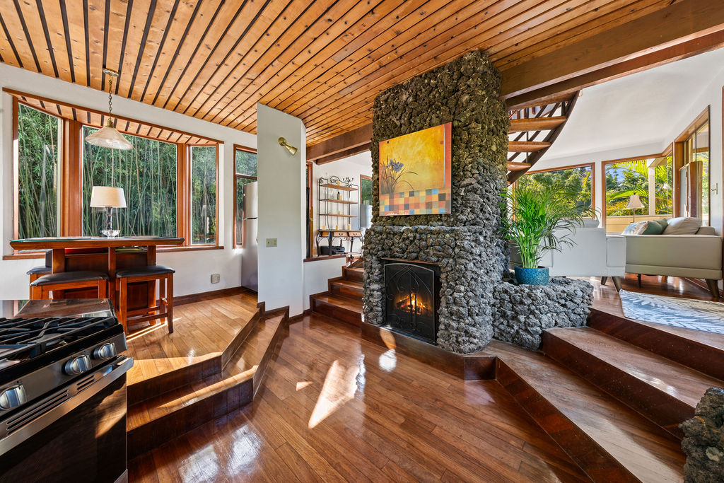 1444 East Kuiaha Road Haiku, HI 96708 - Photo 21 of 29 a living room with furniture fireplace and large windows