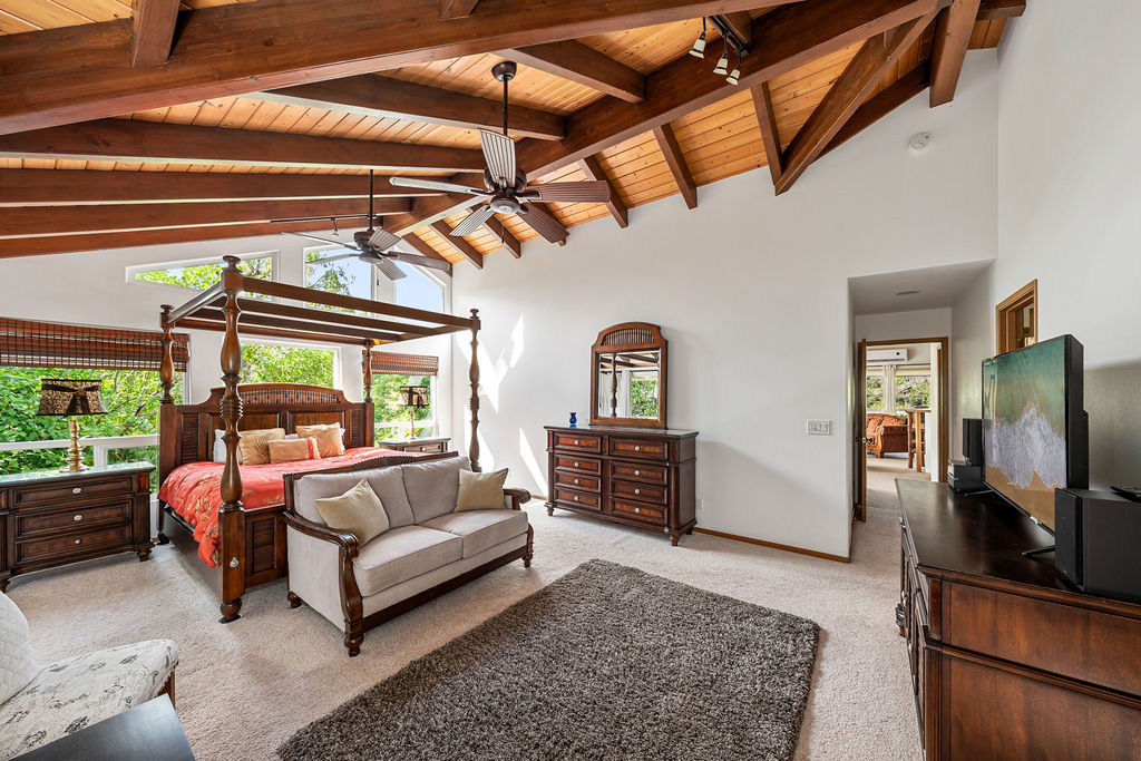 1444 East Kuiaha Road Haiku, HI 96708 - Photo 4 of 29 a living room with furniture a flat screen tv and a refrigerator