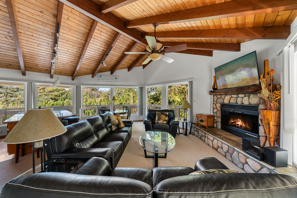 1444 East Kuiaha Road Haiku, HI 96708 - Photo 10 of 29 a living room with furniture a fireplace and a flat screen tv