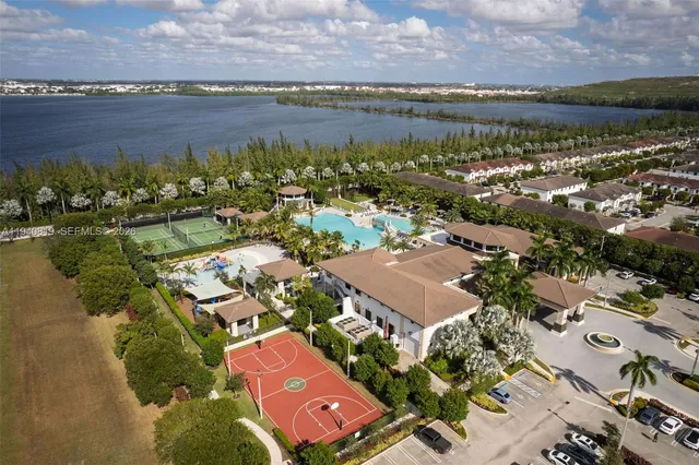 an aerial view of residential building with outdoor space lake and ocean view