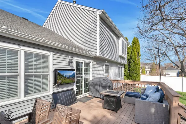 a view of a patio with couches chairs and a fire pit