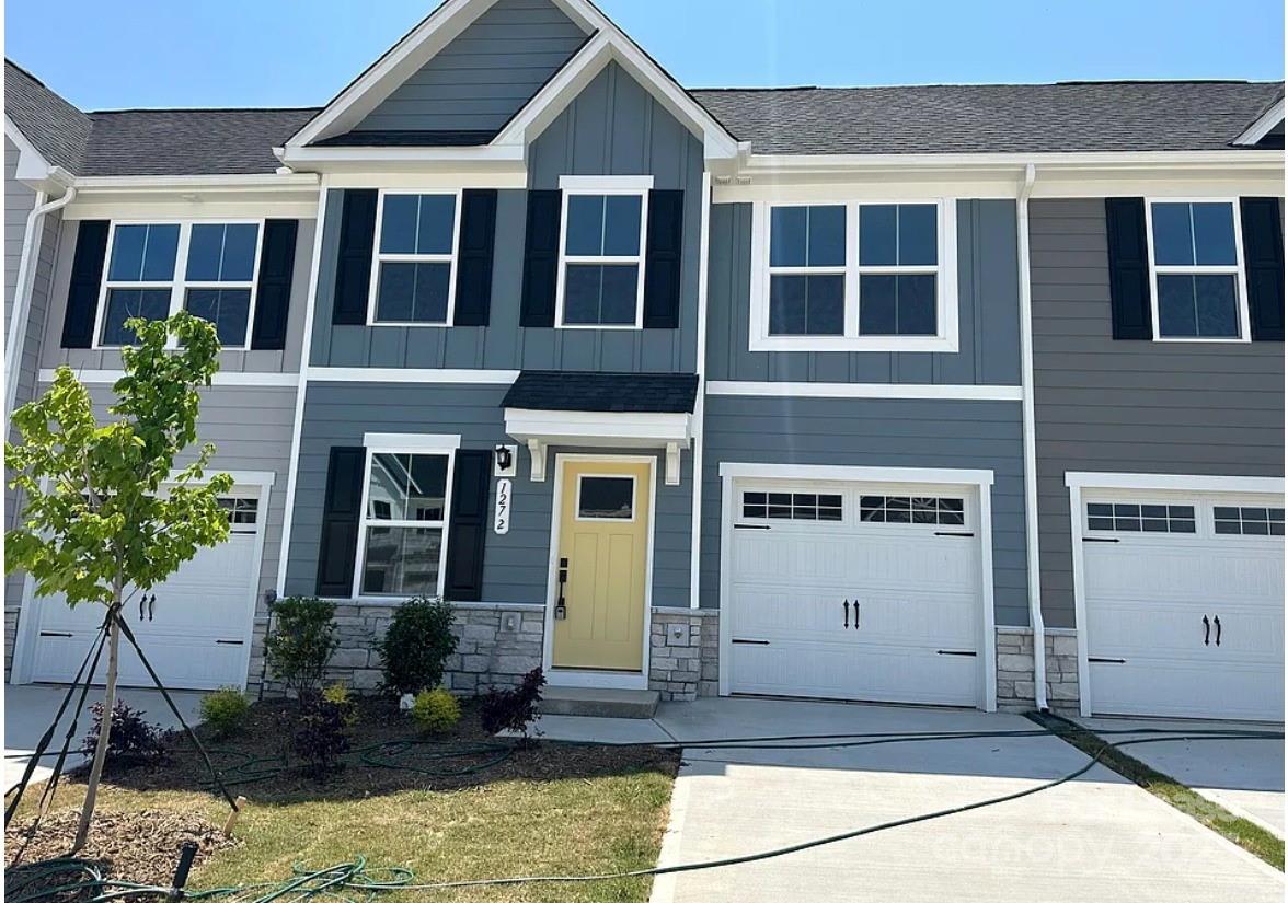127 Jameson Pk Drive, Unit 2 Troutman, NC 28166 - Photo 1 of 20 a front view of a house with a yard