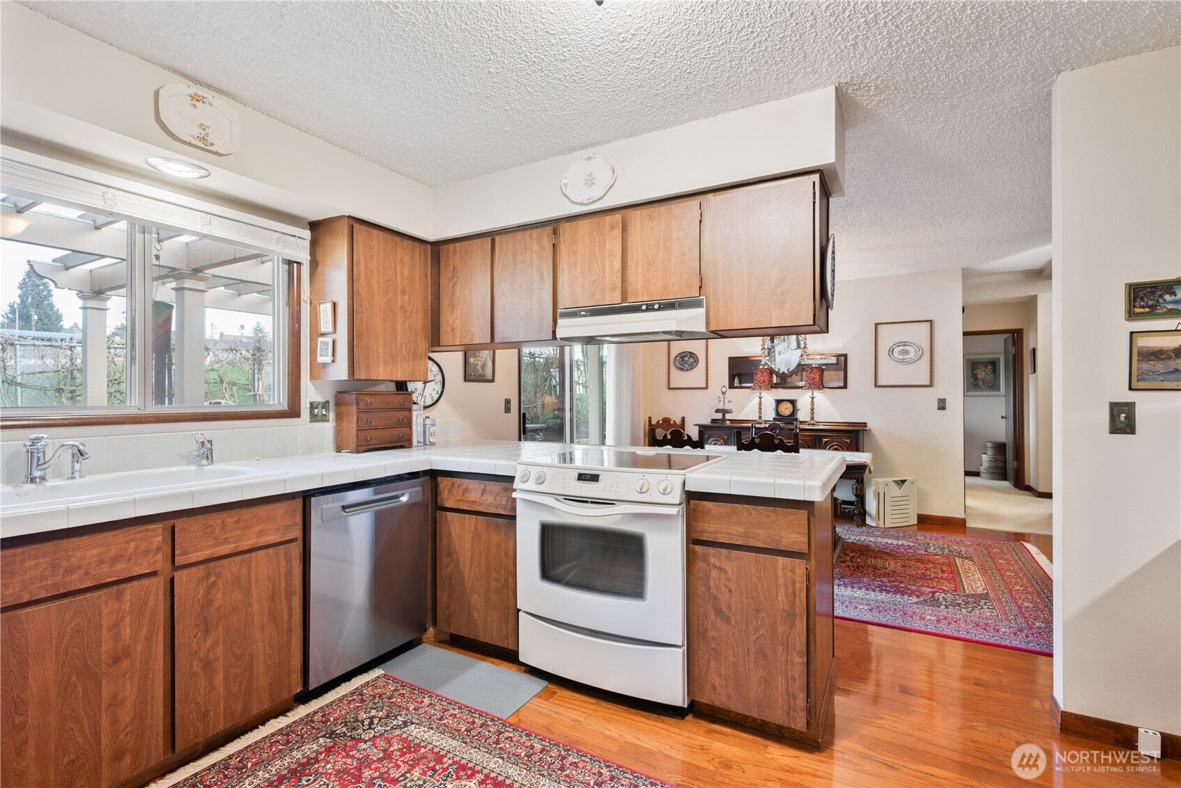 1008 16th Place Kelso, WA 98626 - Photo 11 of 40 a kitchen with appliances cabinets and a sink