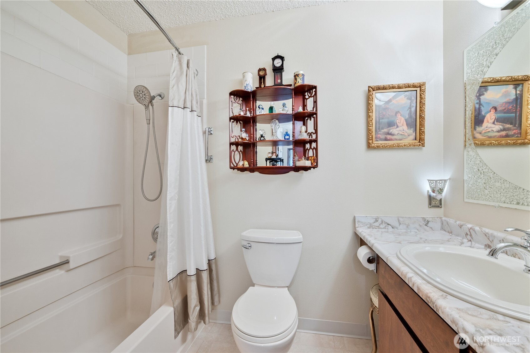 1008 16th Place Kelso, WA 98626 - Photo 16 of 40 a bathroom with a toilet sink and mirror