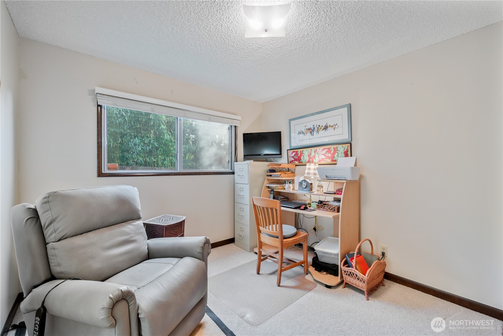 1008 16th Place Kelso, WA 98626 - Photo 17 of 40 a view of a livingroom with workspace and a couch