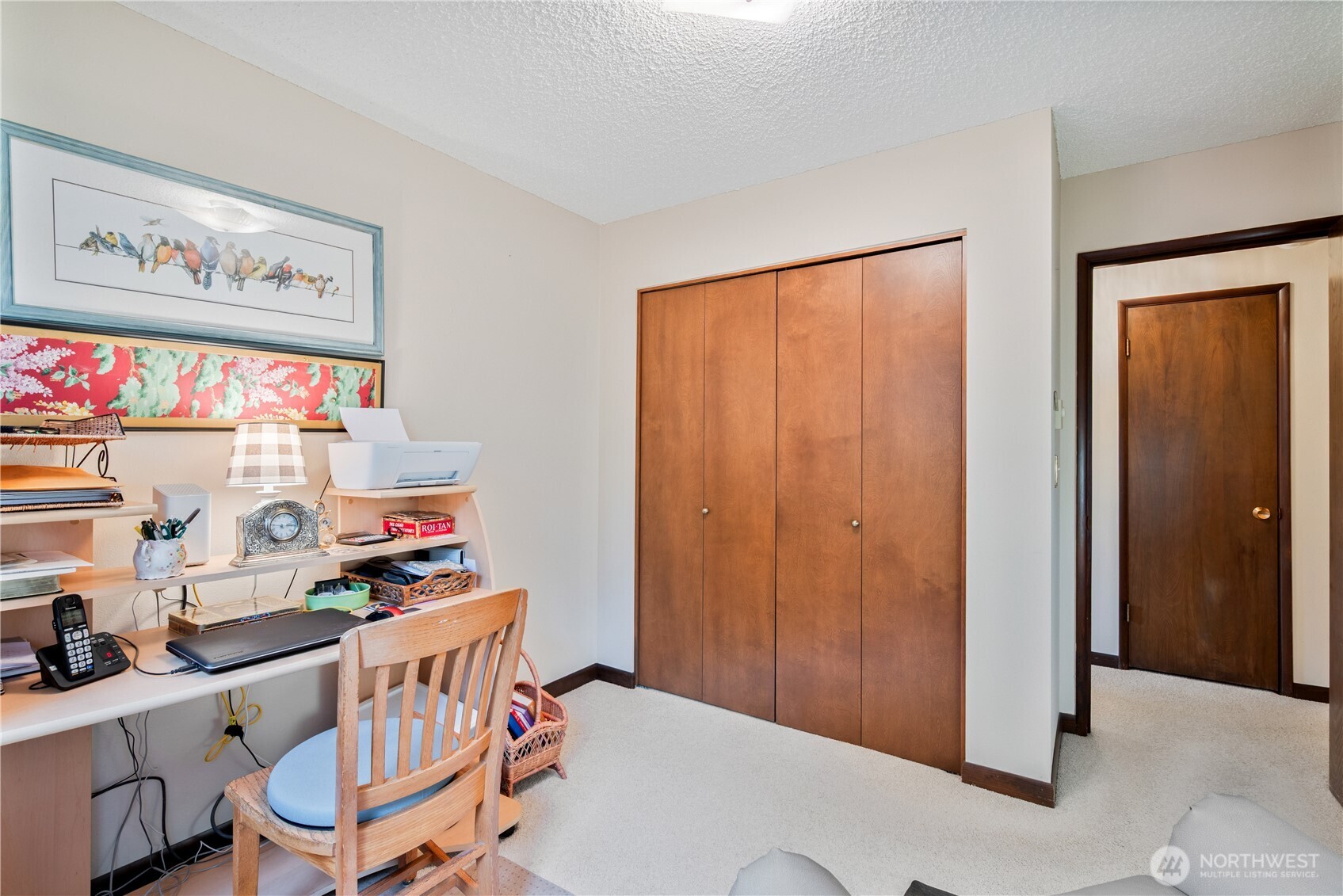 1008 16th Place Kelso, WA 98626 - Photo 18 of 40 a room with furniture a rug and a wall painting