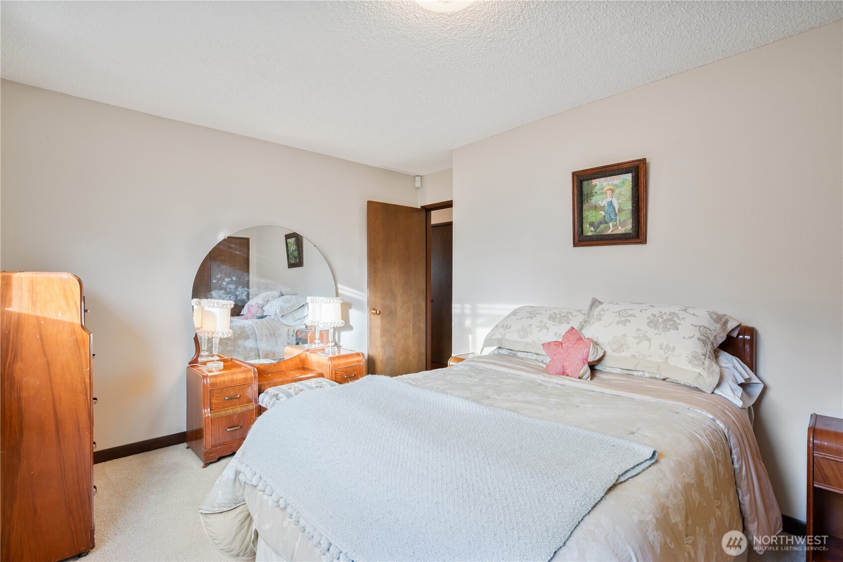 1008 16th Place Kelso, WA 98626 - Photo 20 of 40 a bedroom with a bed a window and dresser