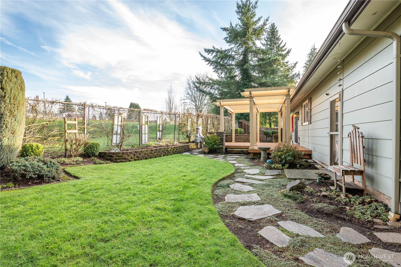 1008 16th Place Kelso, WA 98626 - Photo 26 of 40 a view of a house with backyard sitting area and garden