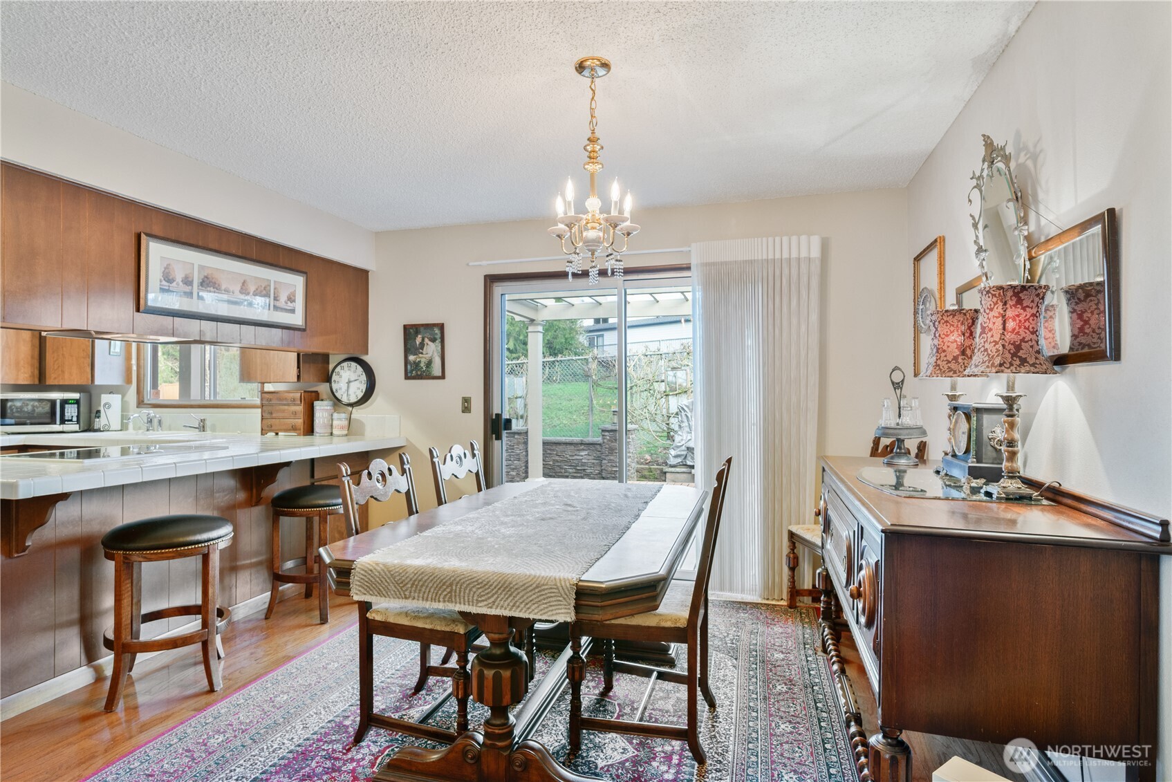 1008 16th Place Kelso, WA 98626 - Photo 9 of 40 a view of a dining room with furniture window and wooden floor