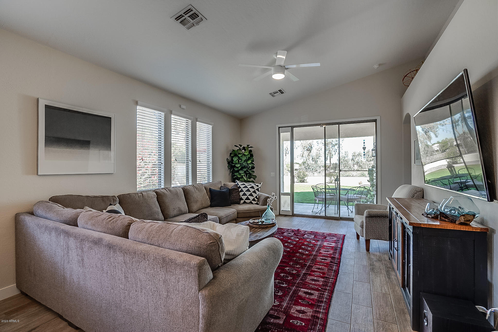 2520 East Fremont Road Phoenix, AZ 85042 - Photo 23 of 62 a living room with furniture and a flat screen tv