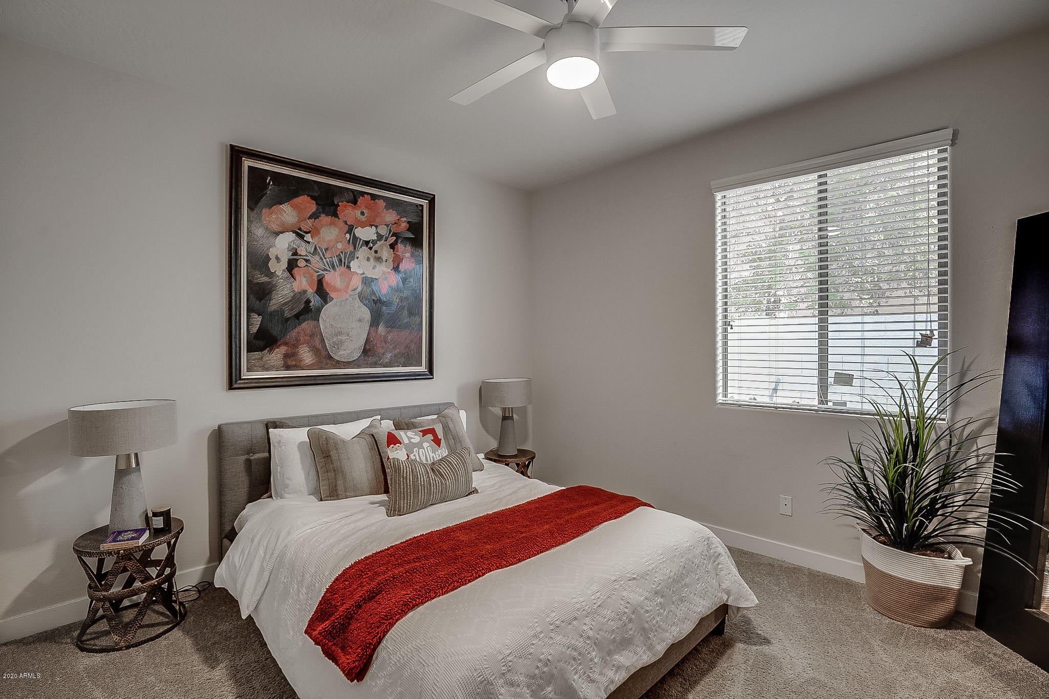 2520 East Fremont Road Phoenix, AZ 85042 - Photo 45 of 62 a bedroom with a bed and a painting on the wall