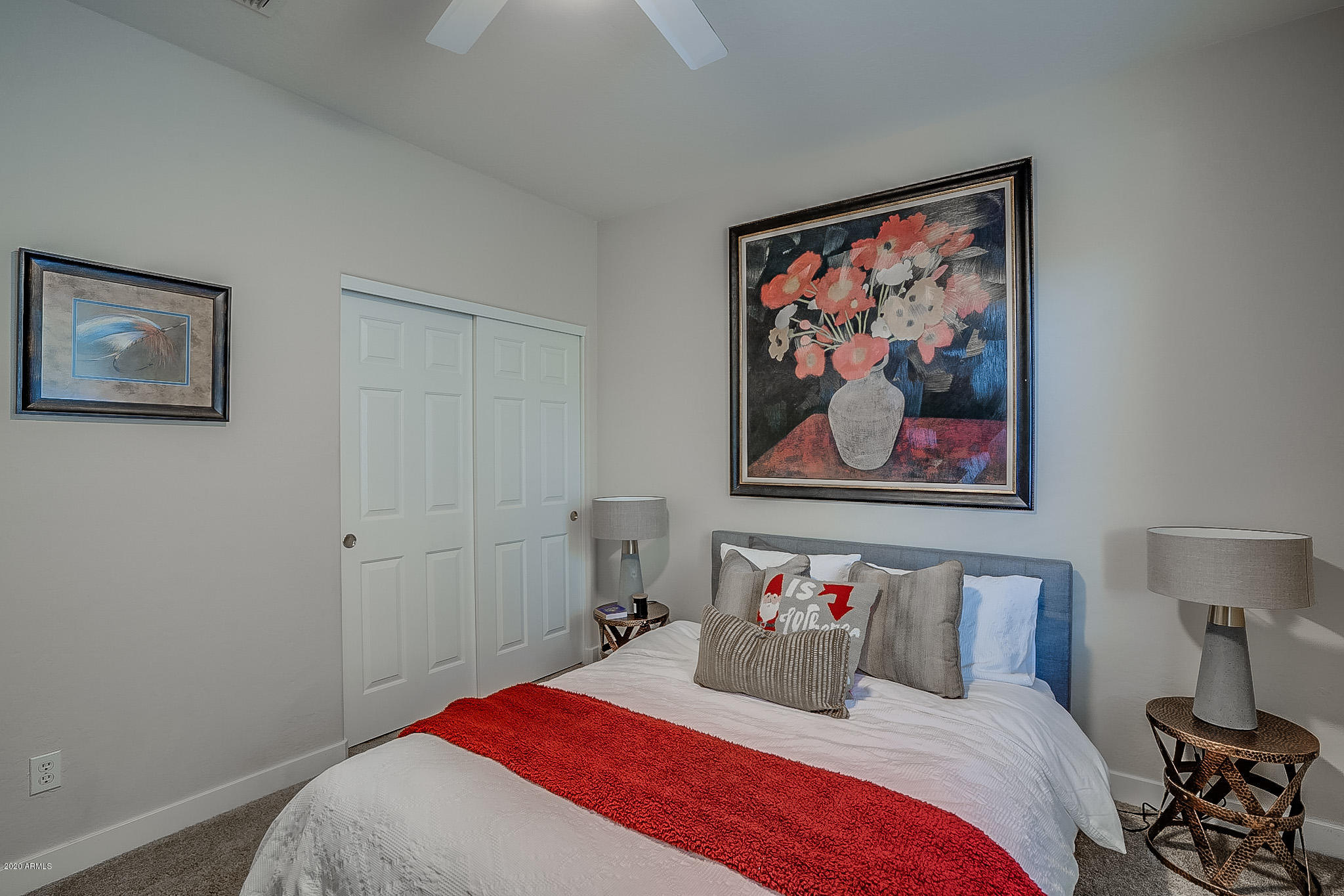 2520 East Fremont Road Phoenix, AZ 85042 - Photo 46 of 62 a bedroom with a bed and a painting on the wall