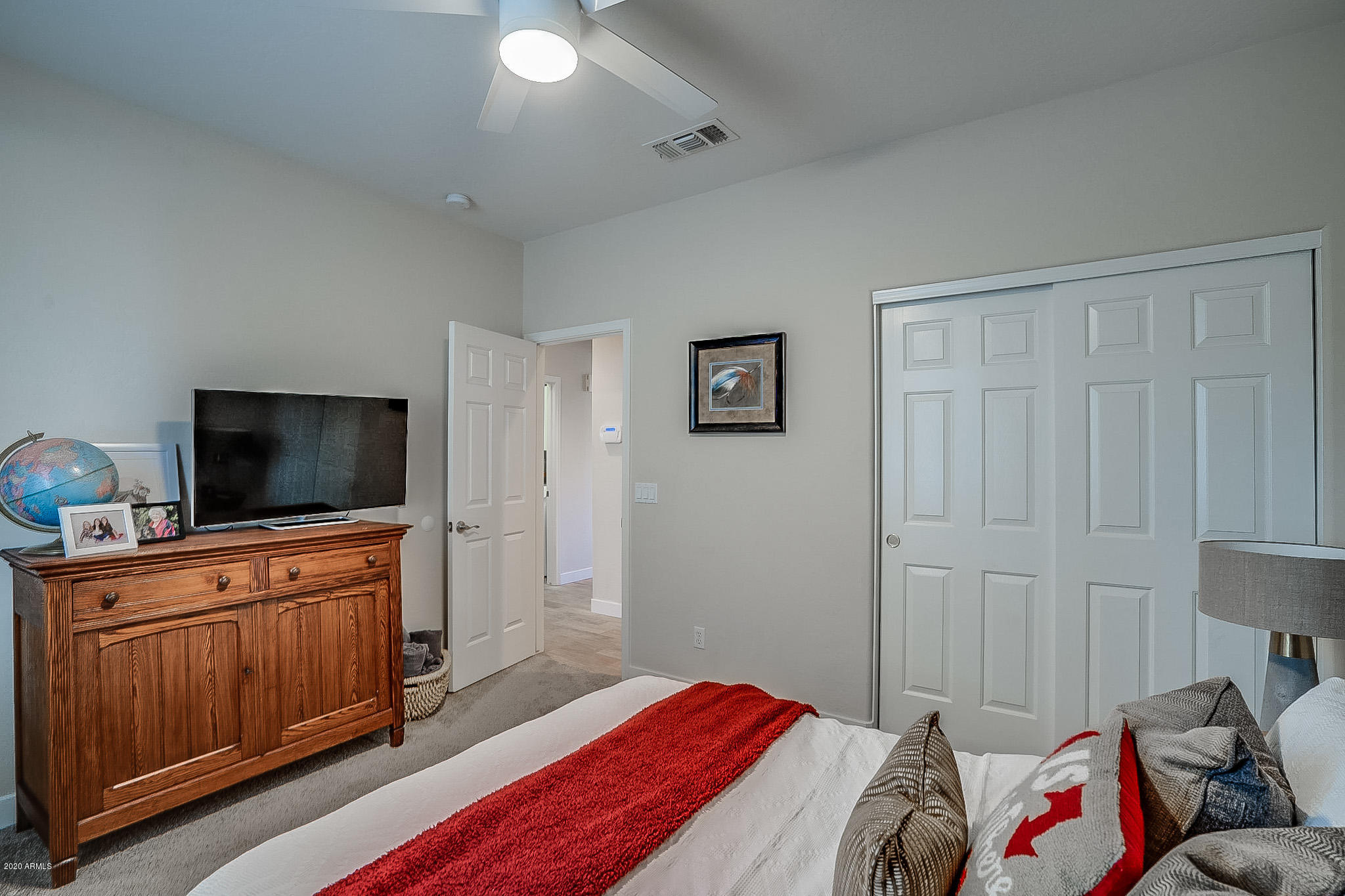 2520 East Fremont Road Phoenix, AZ 85042 - Photo 47 of 62 a bedroom with a bed and flat screen tv