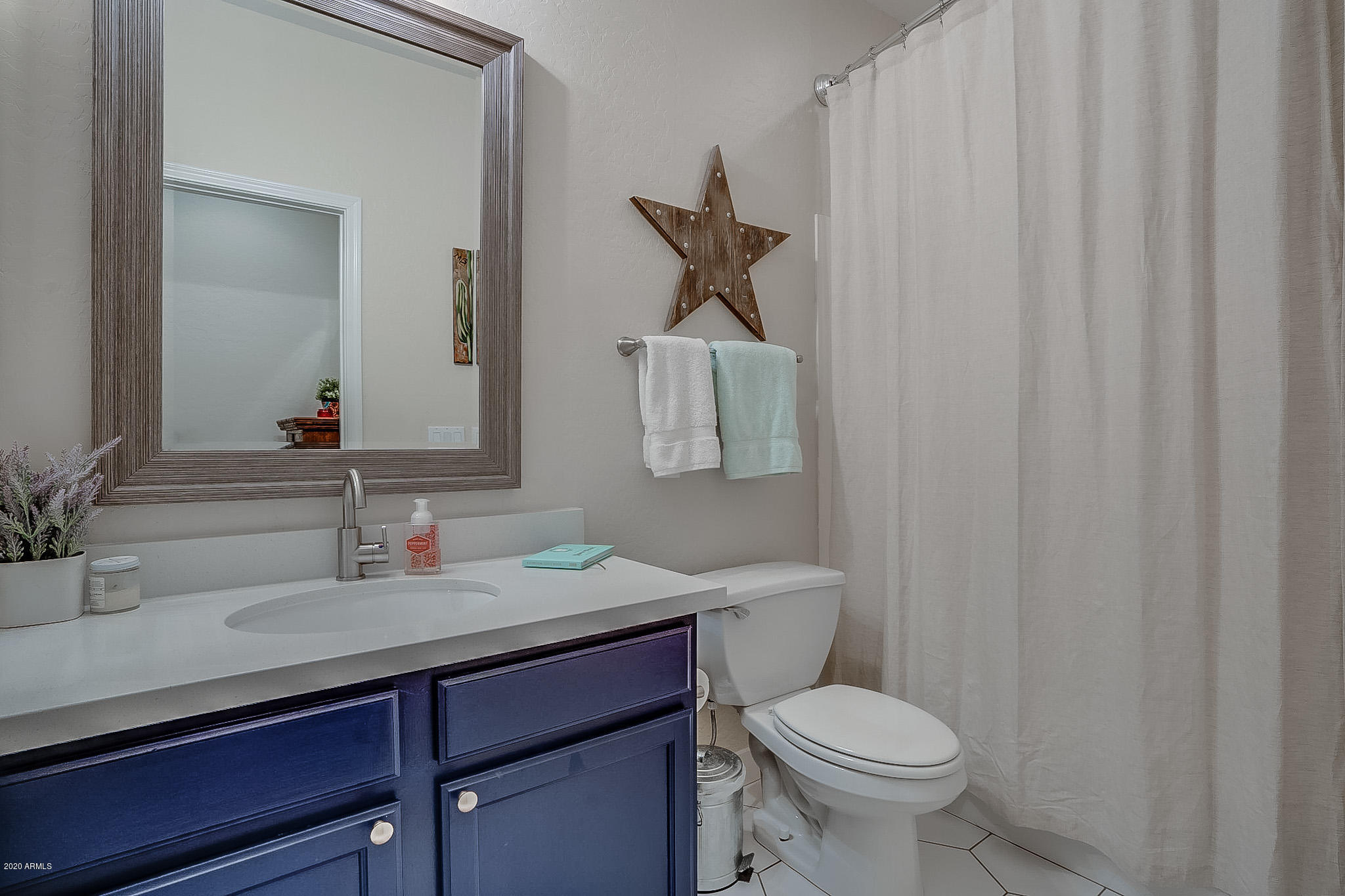 2520 East Fremont Road Phoenix, AZ 85042 - Photo 48 of 62 a bathroom with a sink toilet and mirror