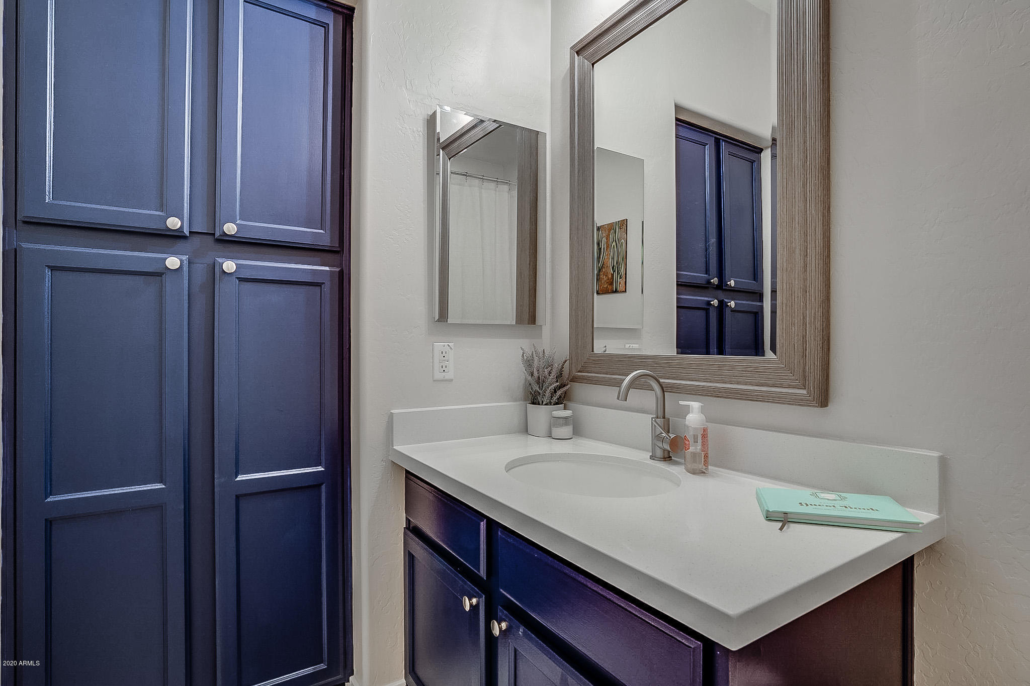 2520 East Fremont Road Phoenix, AZ 85042 - Photo 49 of 62 a bathroom with a sink and a mirror