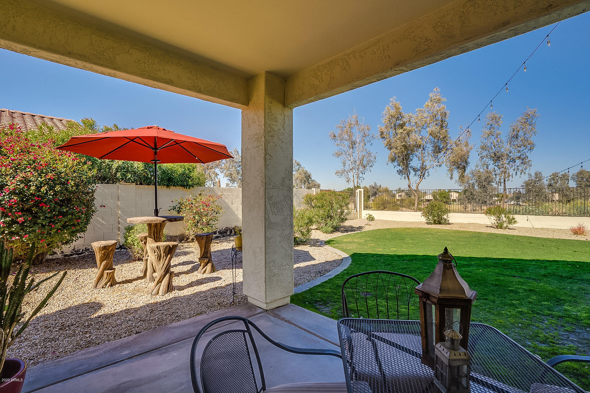 2520 East Fremont Road Phoenix, AZ 85042 - Photo 51 of 62 a view of a chairs and table in patio with a yard