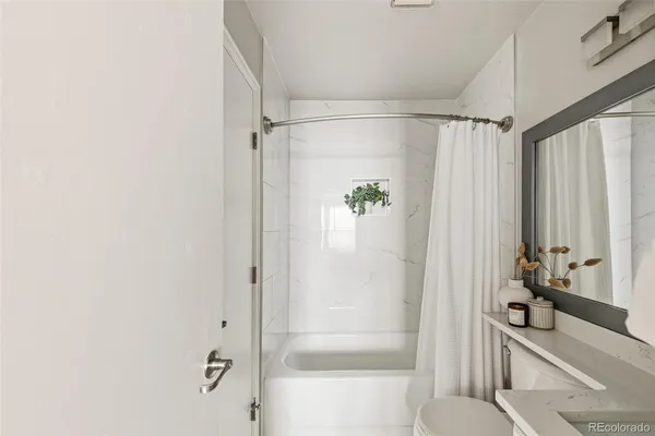 a bathroom with a shower and a tub