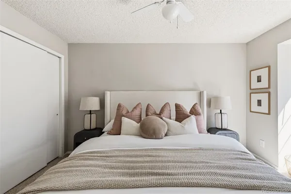 a large white bed in a white room